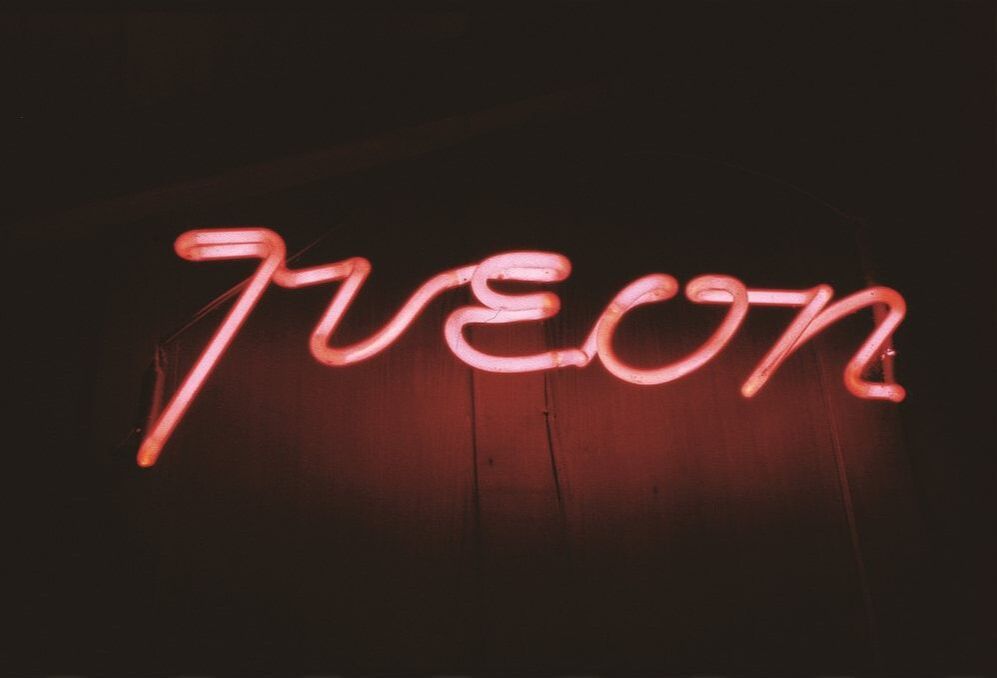Neon sign at night with the word 